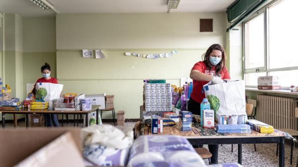 Image of volunteers packing care kits for Save The Children.